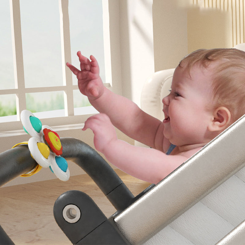 Tecknad snurrande leksak med sugkopp för barn